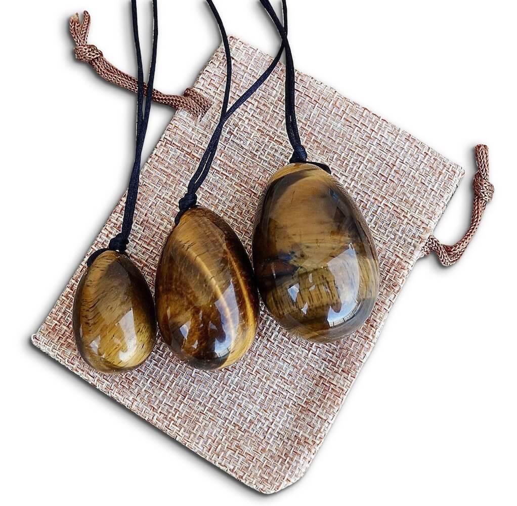 Yellow Tiger Eye Yoni Eggs Set. Free Shipping Available. Buy from Magic Crystals . Yoni Eggs 3-pcs Yoni Eggs Certified  jade eggs, Drilled, with String. Yoni Eggs are highly polished semi-precious gemstones carved especially for the female Yoni (vagina). Natural Yoni Eggs Set - Yoni Eggs drilled.