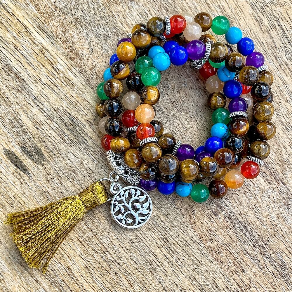 Shop beautiful hand crafted Tiger Eye and 7 Chakras Mala Necklace. High quality Prayer Beads Necklace at Magic Crystals. Magiccrystals.com Inspiring People To Practice Yoga and Meditation. Check out our Mala Necklaces Collection. Mala beads are a string of beads that are used in a meditation practice.