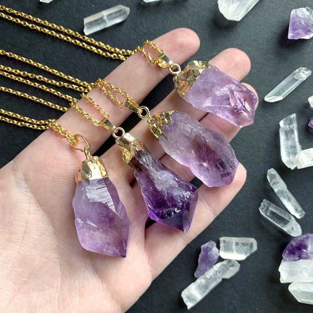 Shop for beautiful Natural Raw Amethyst Dangling Earrings, Gold Dipped with Matching Pendant. Excellent choice for women. available with FREE SHIPPING and in gold. Find a Gold Amethyst Necklace or Gold Amethyst Necklace when you shop at Magic Crystals. February birthstone.