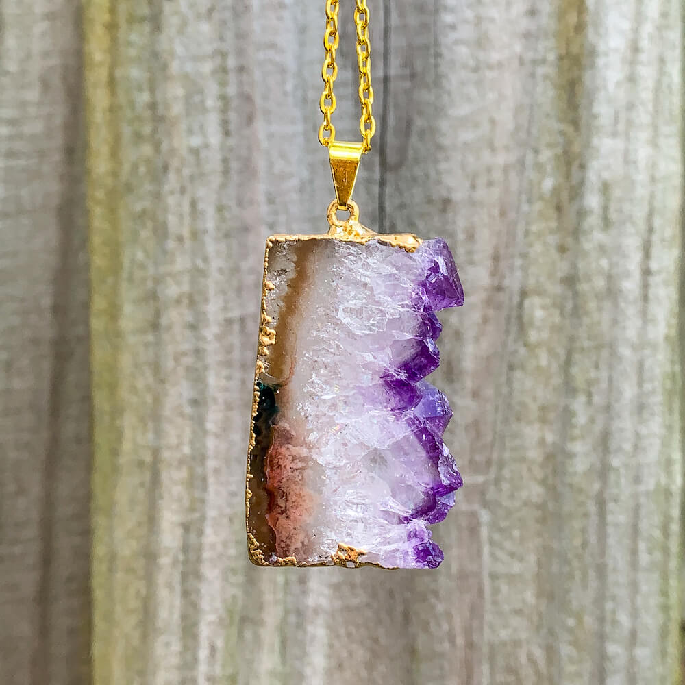 Looking for Raw Amethyst Gold Plated Handmade Pendant Necklace? Shop at Magic Crystals for Amethyst Jewelry. Amethyst Stone necklaces are good for PROTECTION, PURIFICATION, and SPIRITUALITY. Raw Amethyst Slice Pendant February Birthstone Necklace Gold Filled Chain Rectangle. Purple Crystal Gift. Handmade Jewelry.